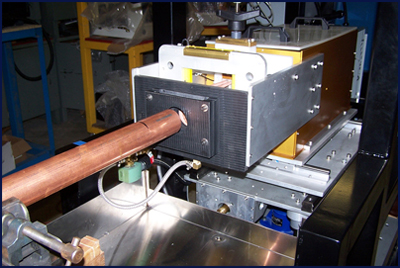 This is a fully automatic system that anneals the 4” length of each copper tube.  Tube size diameters range from 1” to 4”. Process is designed for full automatic operation as the tubes are fed into the induction annealing system, quenched and then retracted away.